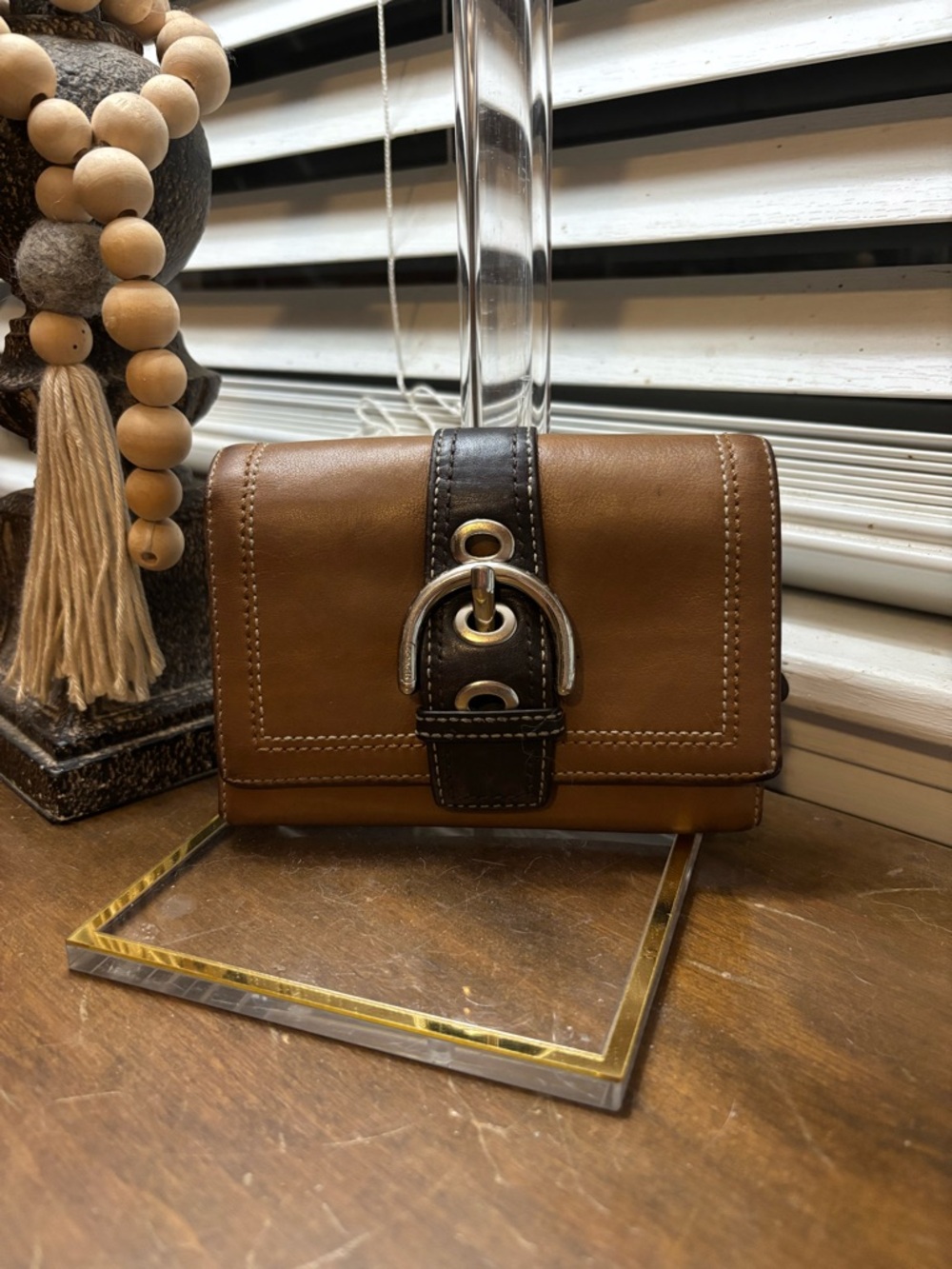 Coach Brown Leather Wallet with Dark Strap and Buckle Detail